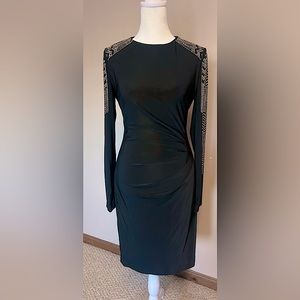 Cache black long-sleeve dress with gold embellished sleeves. Size 6 (US).